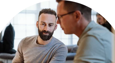 Two men in discussion with one another